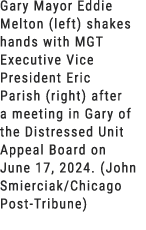 Gary Mayor Eddie Melton (left) shakes hands with MGT Executive Vice President Eric Parish (right) after a meeting in ...