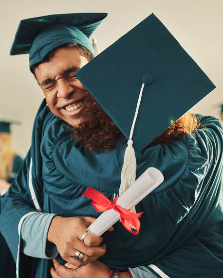 A man wearing a graduation cap and gown is hugging another person. AI generated content