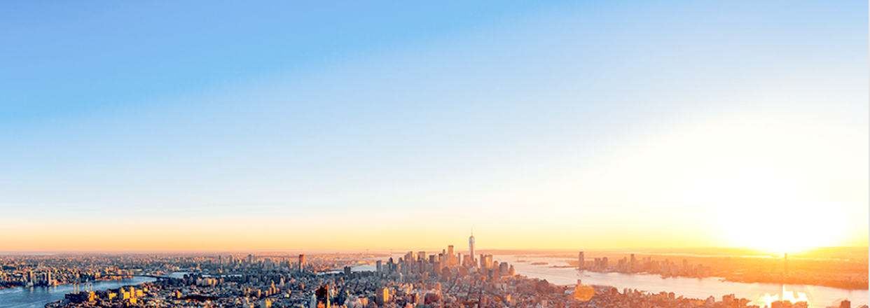 A cityscape with a large building and a sunset in the background. AI generated content