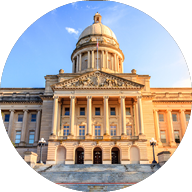 A large building with a dome and columns, possibly a capitol building, with a staircase leading up to it. AI generated content