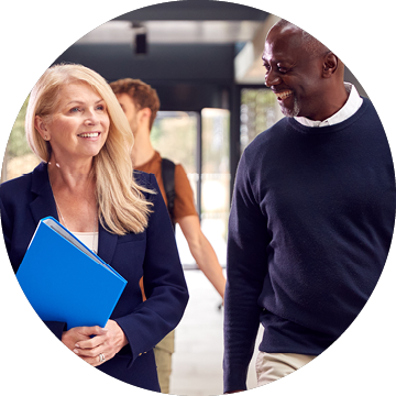 A woman in a black jacket and blue jeans is walking down a hallway with a man in a black and white striped shirt. They are both carrying books. AI generated content